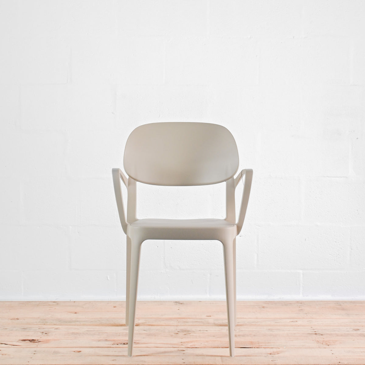 Front view of Alma Amy stacking chair in Sand