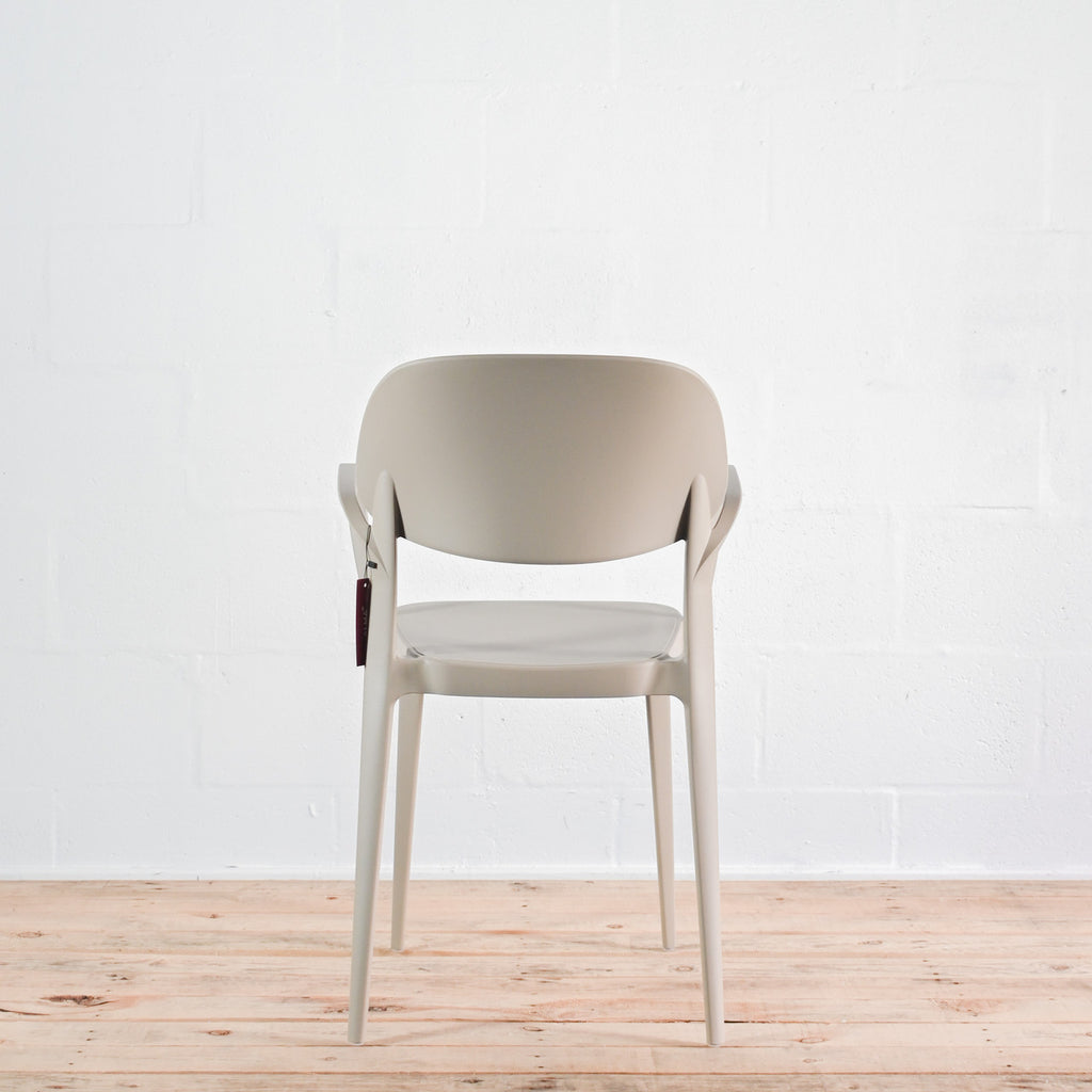 Rear view of Alma Amy stacking chair in Sand